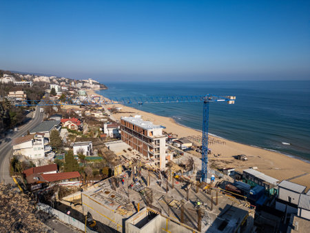 Construction of a new hotel or residential complex on the beachfront in Kabakum Beach, near Varna, Bulgaria, offering stunning views of the Black Sea and golden sandy beachesの写真素材