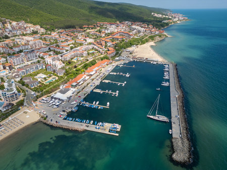 Aerial view of Sveti Vlas, a Bulgarian seaside resort town with a marina, beaches, red-roofed buildings, and green hills. Popular summer destination on the Black Sea coastの写真素材