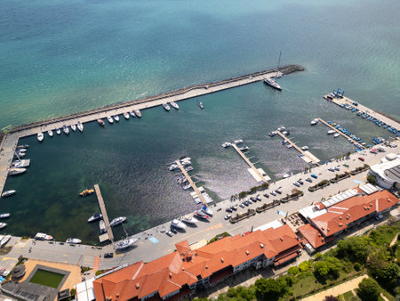 Aerial view of Sveti Vlas, a Bulgarian seaside resort town with a marina, beaches, red-roofed buildings, and green hills. Popular summer destination on the Black Sea coastの写真素材
