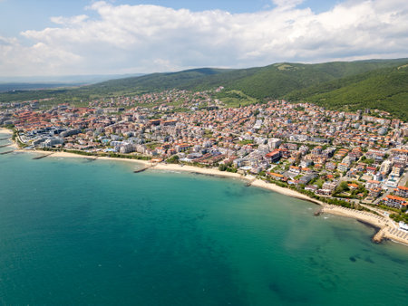 Aerial view of Sveti Vlas, a Bulgarian seaside resort town with a marina, beaches, red-roofed buildings, and green hills. Popular summer destination on the Black Sea coastの写真素材