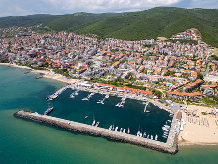 Aerial view of Sveti Vlas, a Bulgarian seaside resort town with a marina, beaches, red-roofed buildings, and green hills. Popular summer destination on the Black Sea coastの写真素材