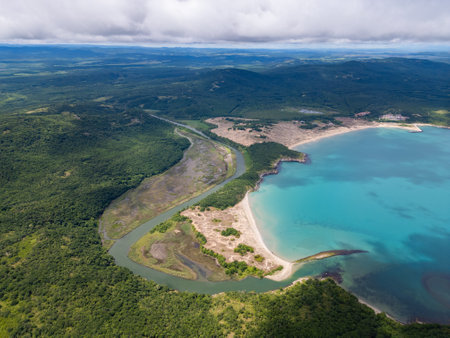 Aerial view of the Ropotamo river mouth in Bulgaria, where the river flows into the Black Sea. Pristine turquoise water, sandbanks, wetlands, and dense forest meet in a stunning natural landscapeの写真素材