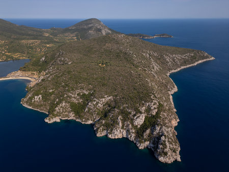 Aerial view of a scenic Mediterranean peninsula with turquoise water, boats, and small beaches. Beautiful summer seascape ideal for travel, tourism, and nature-related projectsの写真素材