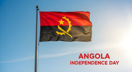Waving Angola National Flag Against Clear Blue Sky for Independence Day Celebrationの素材