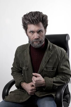 Mr.  IceMan pensive. fashion man in a knitted sweater and jacket.