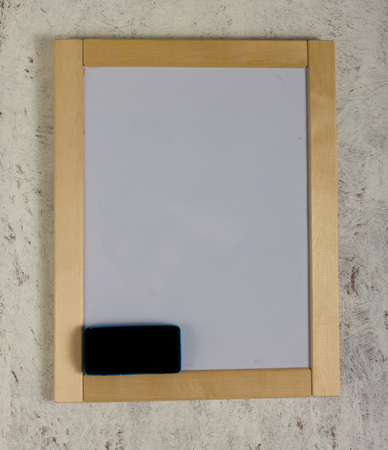 Message board hanging on a grey wall.の写真素材