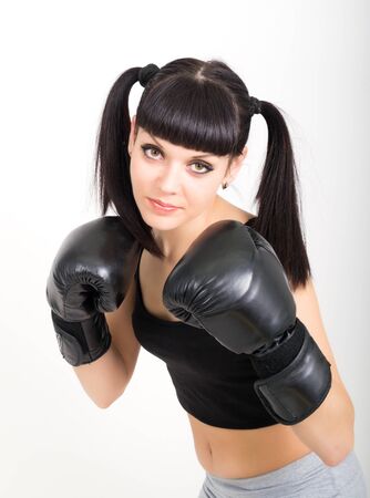 female boxer - fitness woman boxing wearing boxing black glovesの写真素材