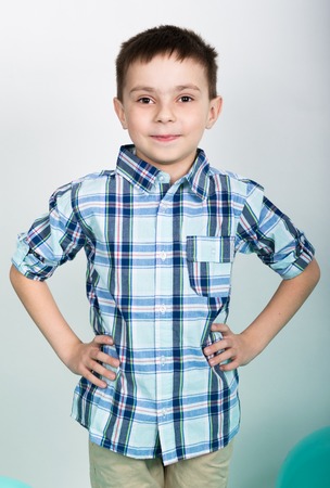 young man standing with his hands on hips.の写真素材