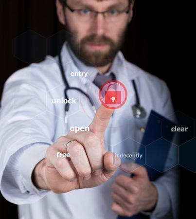 technology, internet and networking in medicine concept - medical doctor presses unlock button on...