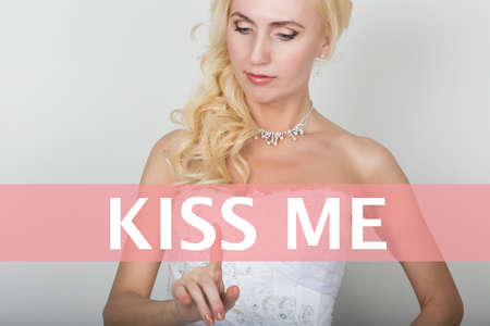 technology, internet and networking concept. Beautiful bride in fashion wedding dress. Bride presses...