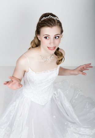 beautiful bride funny pose, expressing different emotions. Beautiful bride with fashion wedding hairstyle. funny bride concept.の写真素材