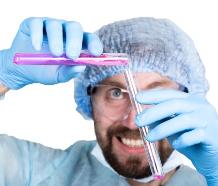 Funny crazy emotional chemist with flask. mad scientist in his laboratory experimenting on secret formulasの写真素材