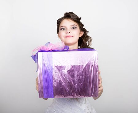 Portrait happy woman with gift box in hands.の写真素材