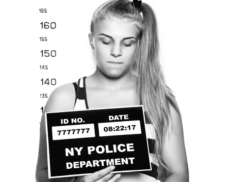 Young beautiful blonde woman Criminal Mug Shots. black and whiteの写真素材