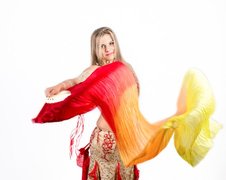 Arabic dance with fans and ribbons performed by a beautiful plump womanの写真素材