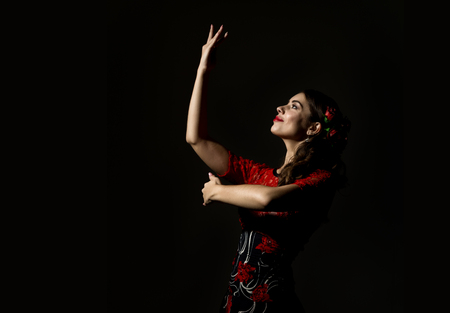 flamenco dancer on a dark background. free space for your textの写真素材