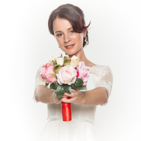 elegant bride with beautiful wedding bouquet in a hands. wedding make-up and hairstyle conceptの写真素材