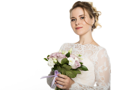 Beautiful bride with wedding bouquet in her hands. free space for your textの写真素材