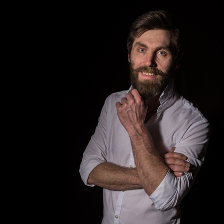 Portrait handsome bearded man, sexy guy on a dark backgroundの写真素材