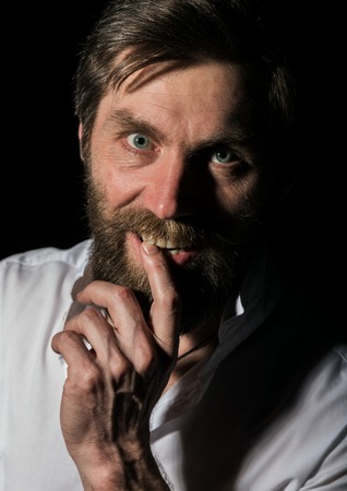 Portrait handsome bearded man, sexy guy on a dark backgroundの写真素材