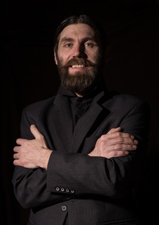 vintage handsome bearded man. severe man on a dark background. free space for your textの写真素材