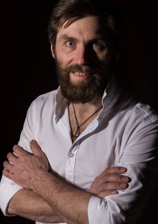 Portrait handsome bearded man, sexy guy on a dark backgroundの写真素材
