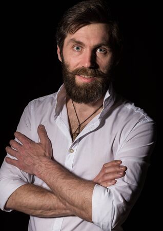 Portrait handsome bearded man, sexy guy on a dark backgroundの写真素材