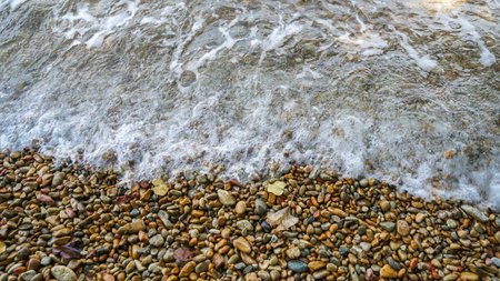 Close up soft wave lapped the sandy beach, Summer Background. Beautiful sea waves with foam. Powerful ocean blue waves with white foam isolated on a white background.の写真素材