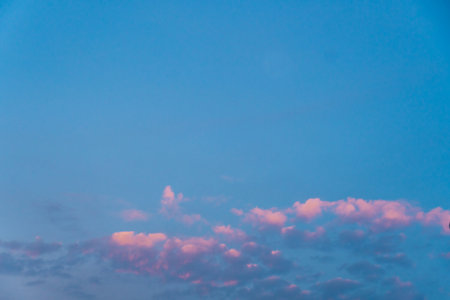 Beautiful multicolored sky after sunset, Used for background. nature sea sky with pink clouds sea voyage walk. Beautiful shot of pink clouds in a clear blue sky with a scenery.の写真素材