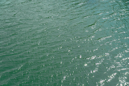 River from above, ocean water surface aerial view, water texture background, light blue green...