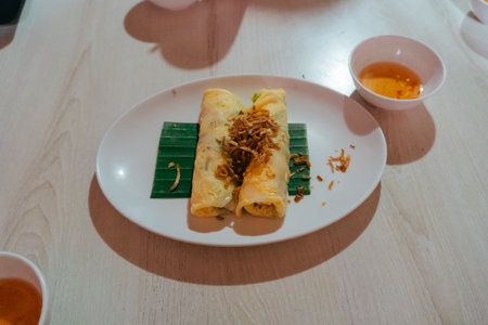 khao kriap pak mor in a pot of boiling water and stretched across a white cloth in a Thai restaurant. Pak Mor Paris Egg Eat. Rice steaming methods, thai food tradition on street food.の写真素材