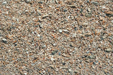 Dead coral fragments lying on a beach, Beach texture, Rocky beach. Texture of pebble stones red and...