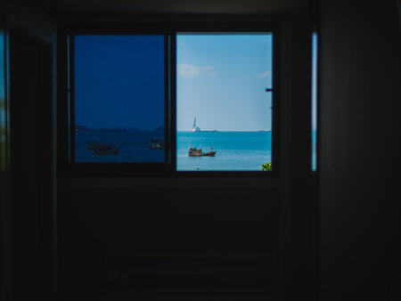 Open window view of the sea tropical landscape. View of the sea bay from the window. Summer, Travel, Vacation and Holiday concept. The open window with sea views in Pattaya ,Thailand.の写真素材
