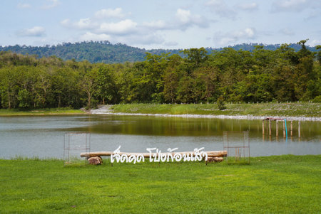 Saraburi, Thailand - May 26: Lush parkland featuring a visitor center. Lakeside camping at Jedkod Pongkonsao Natural Study and Ecotourism Center Saraburi Thailand. Camping trip tent on morning. Adventures Camping tourism and tent. Beautiful lake with tent in place for campingの写真素材