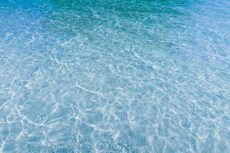 Defocus blurred transparent blue colored clear calm water surface texture. Rippled water. blue water with waves surface background. Sea surface blue.の写真素材