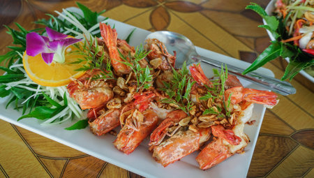 Seafood style Thai food, Shrimps fried or prawns with chilies garlic and salt on white plate. Tasty grilled shrimp on skewers. Fried Shrimp with garlic pepperの写真素材