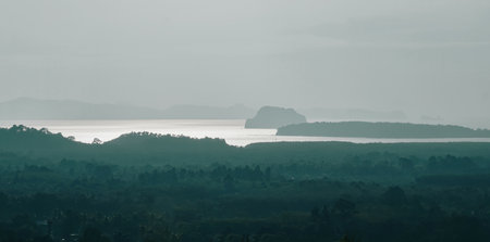 Skyline Landscape of Limestone mountains forest from Din Daeng (Dang) Doi view point in Krabi province, Thailand. Famous travel destination in Southern of Thai. Silhouette blurred view of colorful sunrise sky with mountain range.の写真素材