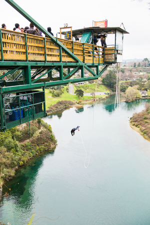 TAUPO, NZ - SEP 13 2014:Person during bunny jump from 47 metres in above the Waikato River in Taupo, New Zealand.のeditorial素材