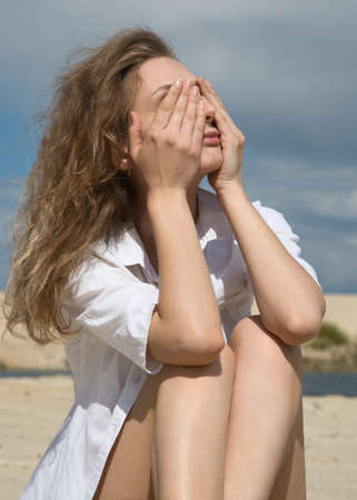 Young, beautiful and sexy woman relaxing on a summer beachの写真素材