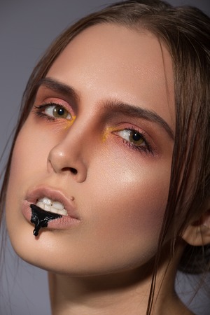 beauty creative makeup with black dribble lipsの写真素材