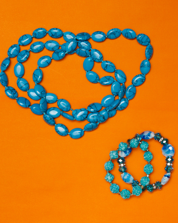 Woman accessories turquoise necklace and bracelet backgroundの写真素材