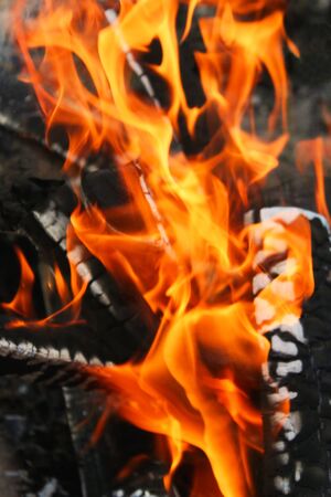 Flames of fire, dancing on the coals.