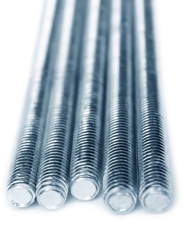 Metal studs with metric thread isolated on white background.の写真素材