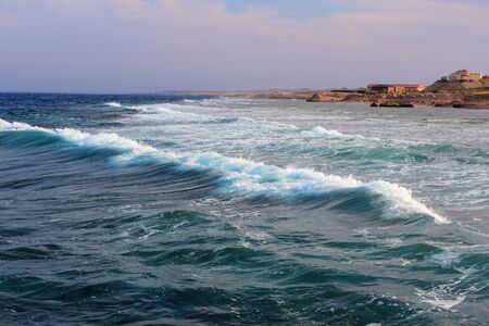 Powerful ocean wave approaching the shore.の写真素材