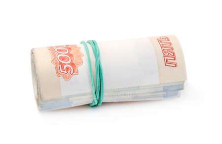 Money rolled into a tube, tapered rubber band isolated on whiteの写真素材