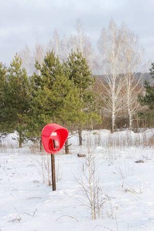 Winter landscape with a view of the fixed telephone in the forestの写真素材