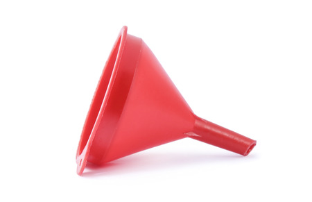 Red plastic funnel for transferring liquids in ware with a narrow neckの写真素材