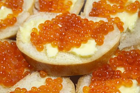 Sandwiches with red caviar and butter closeupの写真素材