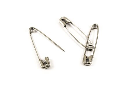 Safety pins isolated on white