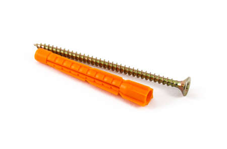 Plastic dowel and self-tapping screw is isoirovanno on a white backgroundの写真素材
